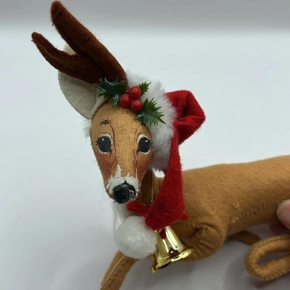 Annalee Reindeer wearing a Santa hat and bell